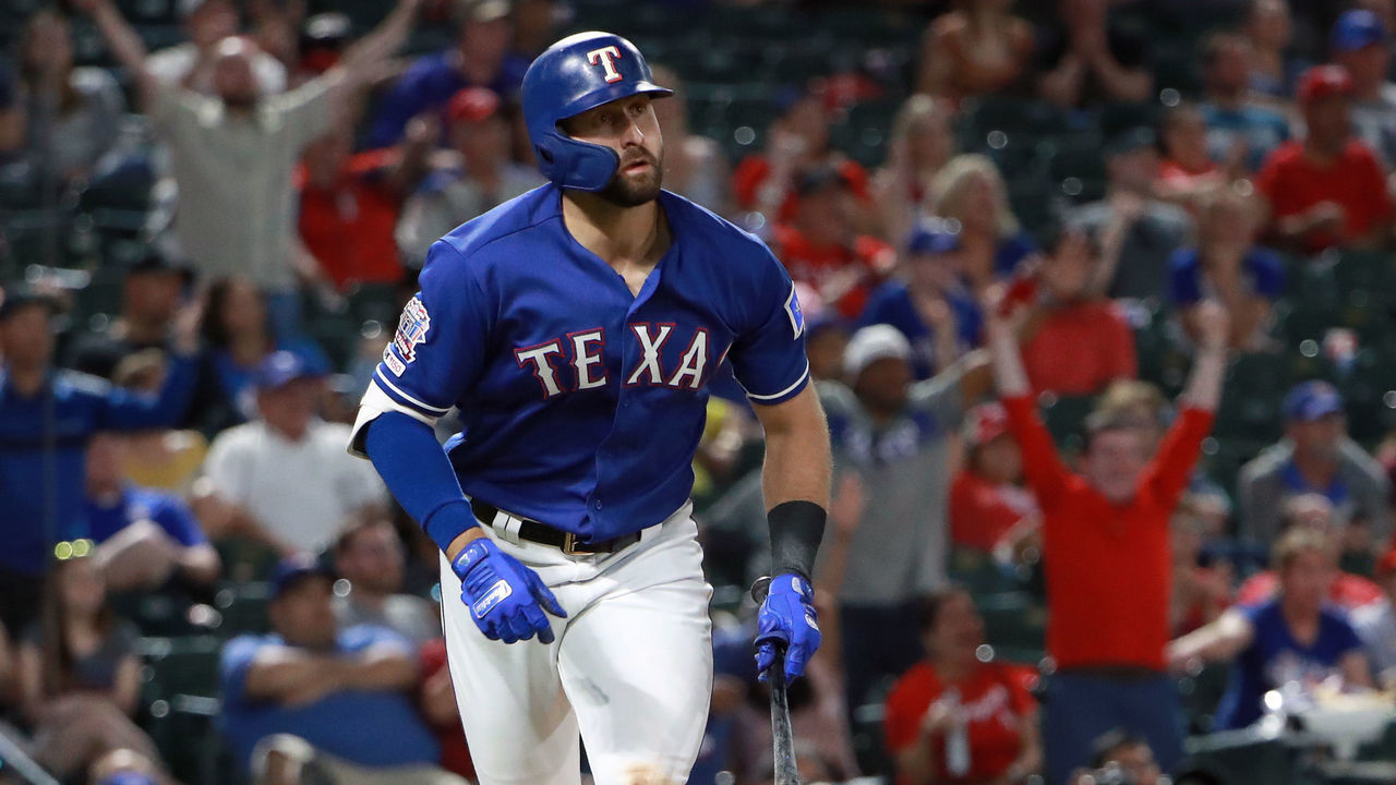 ARLINGTON, TEXAS - MAY 21: Joey Gallo #13 of the Texas Rangers hits a two-run home run against the Seattle Mariners in the bottom of the eighth inning at Globe Life Park in Arlington on May 21, 2019 in Arlington, Texas.