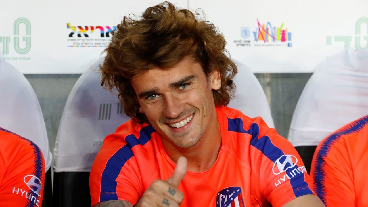 Atletico Madrid's French forward Antoine Griezmann gestures as he sits on the bench during the friendly football match between Beitar Jerusalem and Atletico Madrid at the Teddy Stadium in Jerusalem on May 21, 2019.