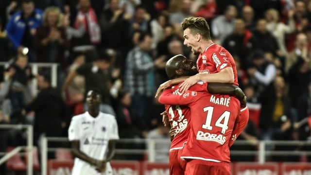 Dijon's Cap Verde forward Julio Tavares (L) celebrates after scoring a goal during the French L1 football match Dijon (DFCO) vs Toulouse (TFC) on May 24, 2019 in Gaston Gerard stadium in Dijon.