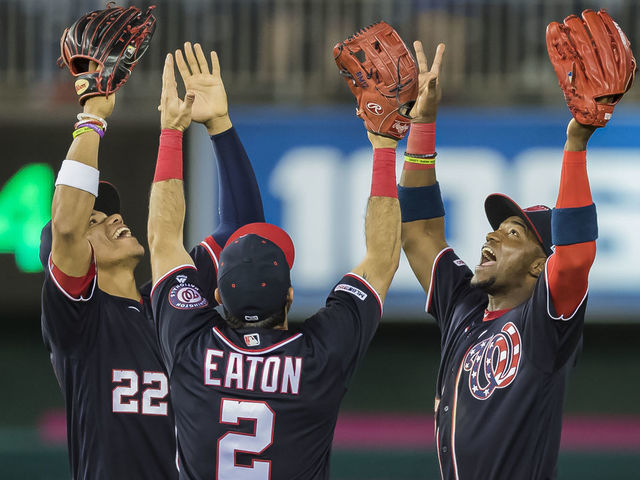 WASHINGTON, DC - MAY 24: Juan Soto #22 of the Washington Nationals celebrates with Adam Eaton #2 and Victor Robles #16 after the game against the Miami Marlins at Nationals Park on May 24, 2019 in Washington, DC.
