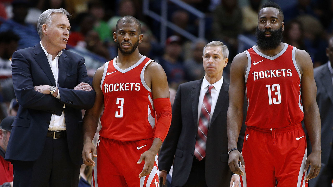 NEW ORLEANS, LA - MARCH 17: Head coach Mike D'Antoni of the Houston Rockets, James Harden #13 and Chris Paul #3 talk during the second half against the New Orleans Pelicans at the Smoothie King Center on March 17, 2018 in New Orleans, Louisiana.