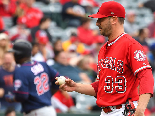 ANAHEIM, CA - MAY 23: Matt Harvey #33 of the Los Angeles Angels of Anaheim stands on the mound as Miguel Sano #22 of the Minnesota Twins rounds third on his solo home run in the third inning at Angel Stadium of Anaheim on May 23, 2019 in Anaheim, California.
