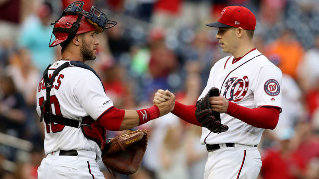 WASHINGTON, DC - MAY 25: Starting pitcher Patrick Corbin #46 of the Washington Nationals celebrates with catcher Yan Gomes #10 after throwing a complete game shutout against the Miami Marlins in the first inning at Nationals Park on May 25, 2019 in Washington, DC.