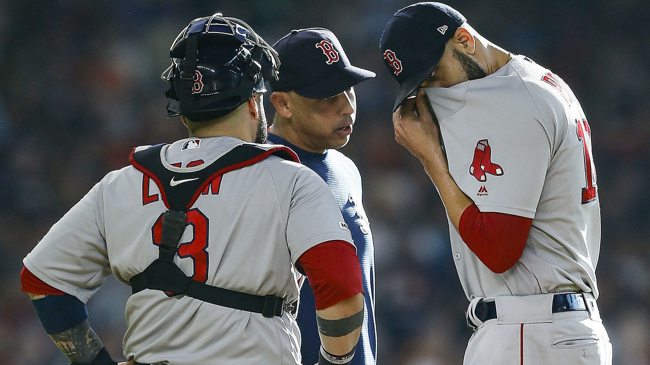 HOUSTON, TEXAS - MAY 25: Manager Alex Cora #20 has words with David Price #10 as Sandy Leon #3 listens in before Price left the game in the first inning of the Boston Red Sox at Minute Maid Park on May 25, 2019 in Houston, Texas.