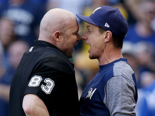 MILWAUKEE, WISCONSIN - MAY 25: Manager Craig Counsell of the Milwaukee Brewers argues with umpire Mike Estabrook in the eighth inning against the Philadelphia Phillies at Miller Park on May 25, 2019 in Milwaukee, Wisconsin.