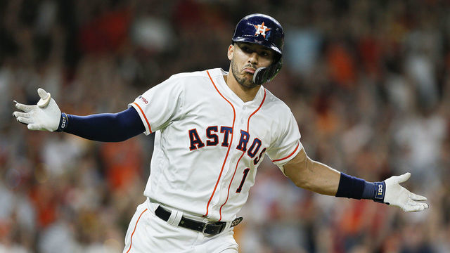 HOUSTON, TEXAS - MAY 25: Carlos Correa #1 of the Houston Astros celebrates after hitting a walk off single in the ninth inning against the Boston Red Sox at Minute Maid Park on May 25, 2019 in Houston, Texas.