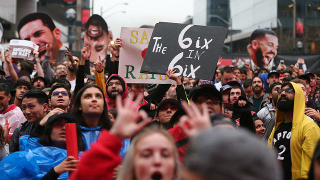 TORONTO, ON- MAY 25 - Toronto fans, some with signs and Drake cutouts, cheer in Jurassic Park as the Toronto Raptors play the Milwaukee Bucks in game six of the NBA Eastern Conference Final in Toronto. May 25, 2019. (Steve Russell/Toronto Star via Getty Images)