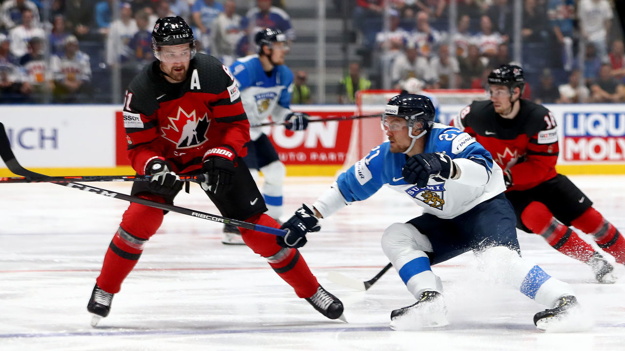 BRATISLAVA, SLOVAKIA - MAY 26: Mark Stone #61 of Canada challenges Juhani Tyrvainen #21 of Finland during the 2019 IIHF Ice Hockey World Championship Slovakia final game between Canada and Finland at Ondrej Nepela Arena on May 26, 2019 in Bratislava, Slovakia.