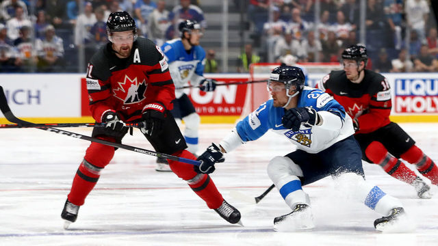 BRATISLAVA, SLOVAKIA - MAY 26: Mark Stone #61 of Canada challenges Juhani Tyrvainen #21 of Finland during the 2019 IIHF Ice Hockey World Championship Slovakia final game between Canada and Finland at Ondrej Nepela Arena on May 26, 2019 in Bratislava, Slovakia.