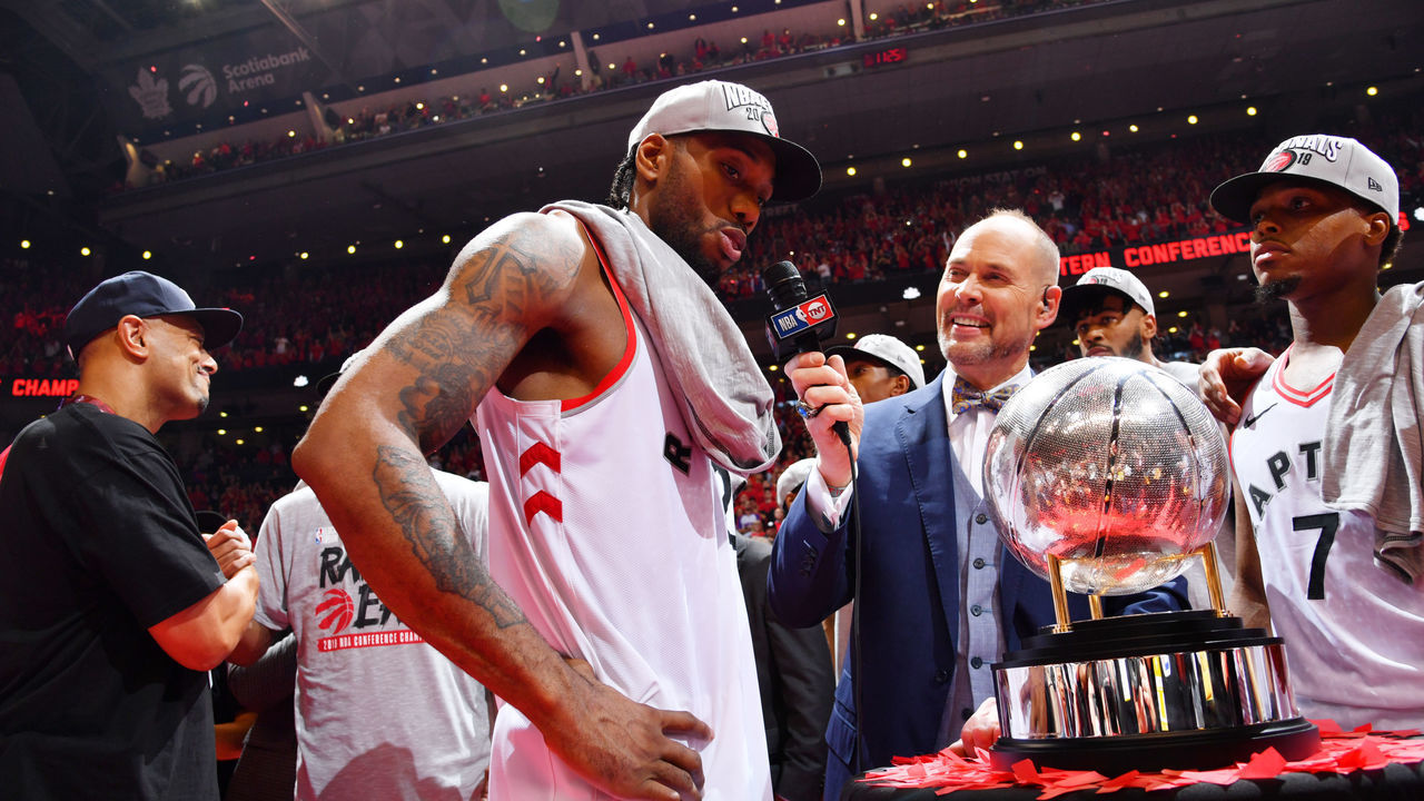 TORONTO, CANADA - MAY 25: Ernie Johnson interviews Kawhi Leonard #2 of the Toronto Raptors after a game between the Milwaukee Bucks and the Toronto Raptors during Game Six of the Eastern Conference Finals on May 25, 2019 at Scotiabank Arena in Toronto, Ontario, Canada. NOTE TO USER: User expressly acknowledges and agrees that, by downloading and/or using this photograph, user is consenting to the terms and conditions of the Getty Images License Agreement. Mandatory Copyright Notice: Copyright 2019 NBAE