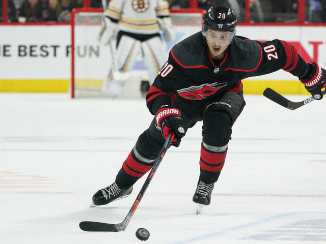 RALEIGH, NC - MAY 14: Carolina Hurricanes center Sebastian Aho (20) skates after a loose puck during a game between the Boston Bruins and the Carolina Hurricanes on May 14, 2019 at the PNC Arena in Raleigh, NC.