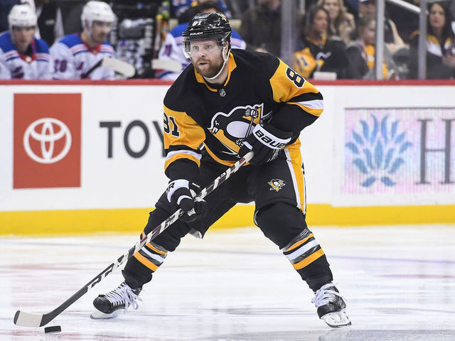 PITTSBURGH, PA - APRIL 06: Pittsburgh Penguins Right Wing Phil Kessel (81) carries the puck up ice during the second period in the NHL game between the Pittsburgh Penguins and the New York Rangers on April 6, 2019, at PPG Paints Arena in Pittsburgh, PA.