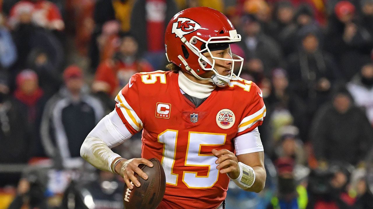 KANSAS CITY, MO - JANUARY 20: Quarterback Patrick Mahomes #15 of the Kansas City Chiefs rolls out against the New England Patriots during the first half of the AFC Championship Game at Arrowhead Stadium on January 20, 2019 in Kansas City, Missouri.