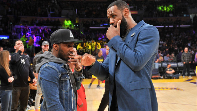 LOS ANGELES, CALIFORNIA - JANUARY 13: LeBron James talks to his agent Rich Paul during halftime of a basketball game between the Los Angeles Lakers and the Cleveland Cavaliers at Staples Center on January 13, 2019 in Los Angeles, California.