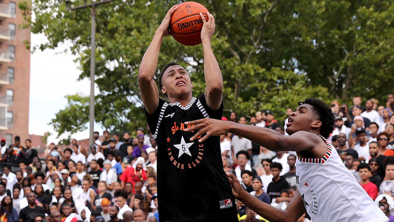 NEW YORK, NY - AUGUST 18: RJ Hampton #5 of Team Ramsey heads for the net as Josh Christopher #3 of Team Stanley defends during the SLAM Summer Classic 2018 at Dyckman Park on August 18, 2018 in New York City.