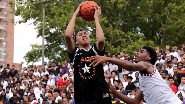 NEW YORK, NY - AUGUST 18: RJ Hampton #5 of Team Ramsey heads for the net as Josh Christopher #3 of Team Stanley defends during the SLAM Summer Classic 2018 at Dyckman Park on August 18, 2018 in New York City.