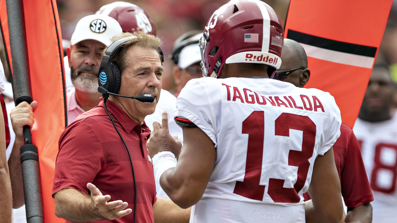 FAYETTEVILLE, AR - OCTOBER 6: Head Coach Nick Saban talks with Tua Tagovailoa #13 of the Alabama Crimson Tide as he comes off the field in the first quarter of a game against the Arkansas Razorbacks at Razorback Stadium on October 6, 2018 in Tuscaloosa, Alabama. The Crimson Tide defeated the Razorbacks 65-31.