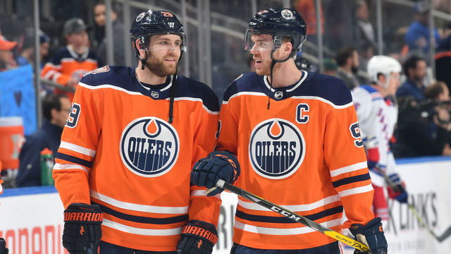 EDMONTON, AB - MARCH 11: Connor McDavid #97 and Leon Draisaitl #29 of the Edmonton Oilers warm up prior to the game against the New York Rangers on March 11, 2019 at Rogers Place in Edmonton, Alberta, Canada.