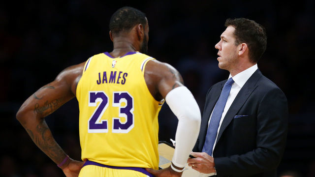 LOS ANGELES, CALIFORNIA - MARCH 26: LeBron James #23 speaks with Los Angeles Lakers head coach Luke Walton during the second half of the game against the Washington Wizards at Staples Center on March 26, 2019 in Los Angeles, California.