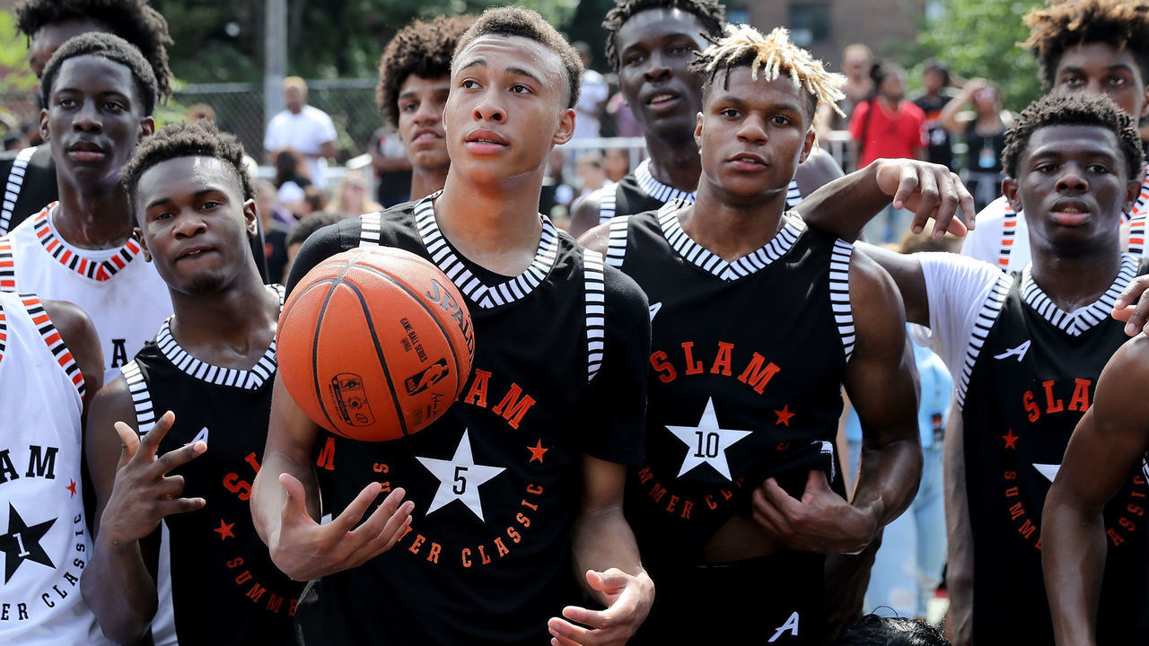 NEW YORK, NY - AUGUST 18: RJ Hampton #5 and Jahmius Ramsey #10 of Team Ramsey pose for pictures on the court with Zion Harmon #1 of Team Stanley during the SLAM Summer Classic 2018 at Dyckman Park on August 18, 2018 in New York City.