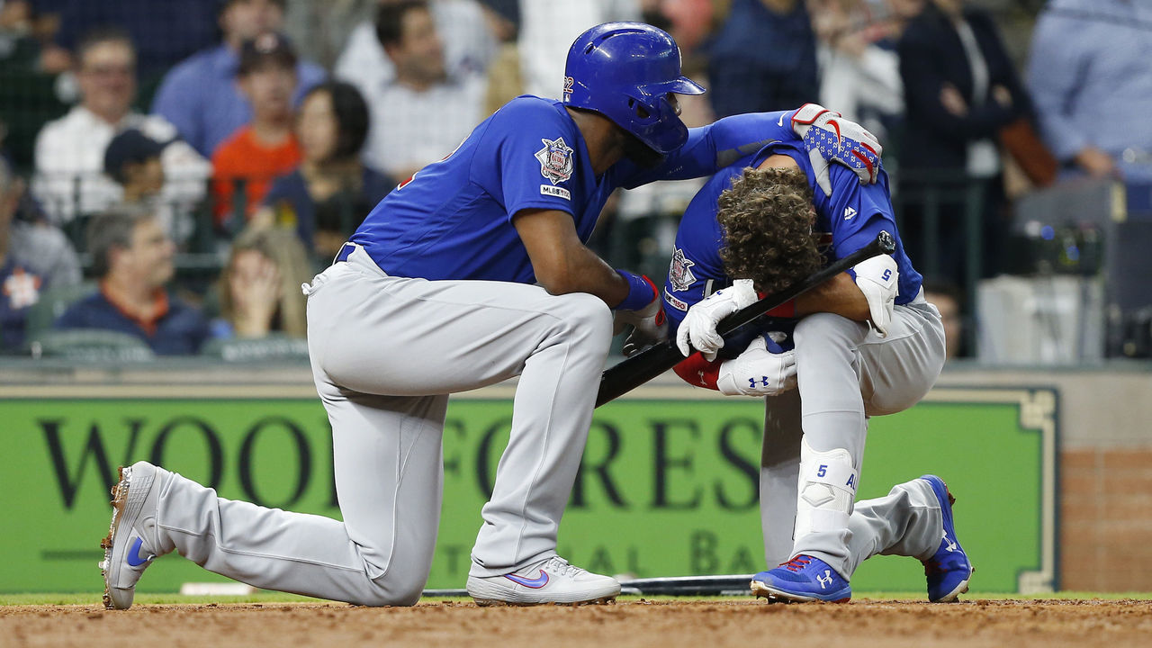 HOUSTON, TEXAS - MAY 29: Albert Almora Jr. #5 of the Chicago Cubs is comforted by Jason Heyward #22 after a young child was injured by a foul ball off his bat in the fourth inning against the Houston Astros at Minute Maid Park on May 29, 2019 in Houston, Texas.