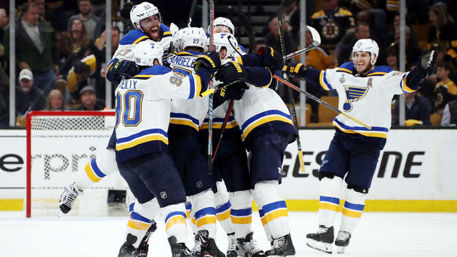 BOSTON, MASSACHUSETTS - MAY 29: Carl Gunnarsson #4 of the St. Louis Blues is congratulated by his teammates after scoring the game winning goal during the first overtime period against the Boston Bruins in Game Two of the 2019 NHL Stanley Cup Final at TD Garden on May 29, 2019 in Boston, Massachusetts.