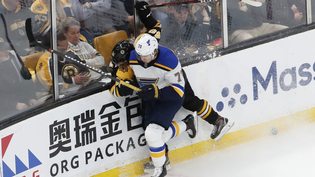 BOSTON, MA - MAY 29: St. Louis Blues center Oskar Sundqvist (70) puts Boston Bruins left defenseman Matt Grzelcyk (48) out of the game during Game 2 of the 2019 Stanley Cup Finals between the Boston Bruins and the St. Louis Blues on May 29, 2019, at TD Garden in Boston, Massachusetts.
