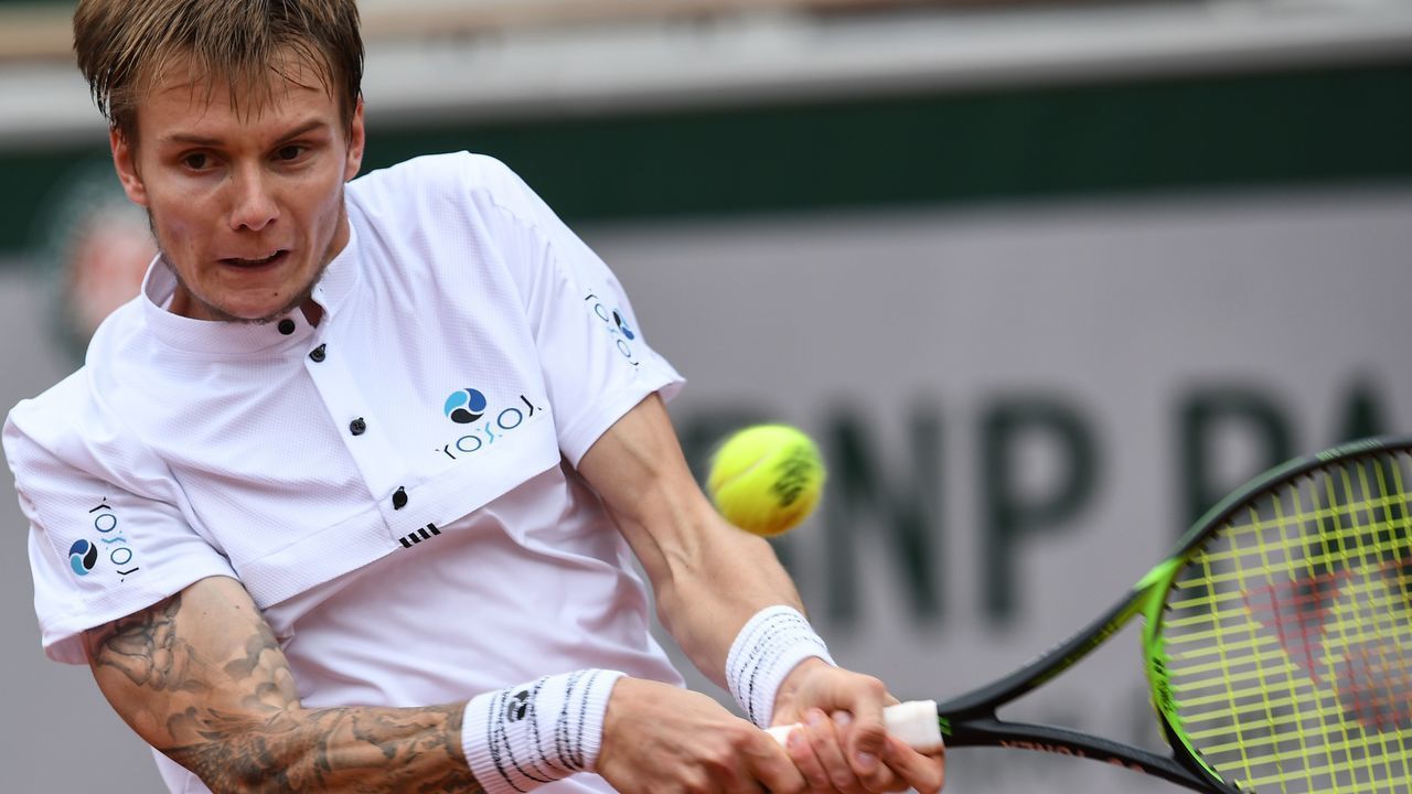 Kazakhstan's Alexander Bublik returns the ball to Austria's Dominic Thiem during their men's singles second round match on day five of The Roland Garros 2019 French Open tennis tournament in Paris on May 30, 2019.