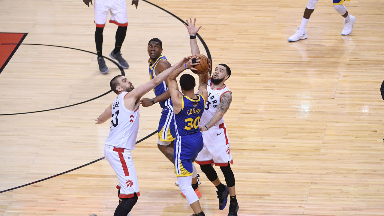 TORONTO, CANADA - MAY 30: Marc Gasol #33 of the Toronto Raptors and Fred VanVleet #23 of the Toronto Raptors trap Stephen Curry #30 of the Golden State Warriors during Game One of the NBA Finals on May 30, 2019 at Scotiabank Arena in Toronto, Ontario, Canada. NOTE TO USER: User expressly acknowledges and agrees that, by downloading and/or using this photograph, user is consenting to the terms and conditions of the Getty Images License Agreement. Mandatory Copyright Notice: Copyright 2019 NBAE