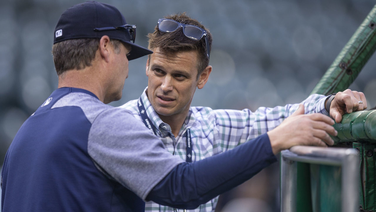 SEATTLE, WA - MAY 3: Seattle Mariners general manager Jerry Dipoto (R) talks with manager Scott Servais before a game between the Oakland Athletics and the Seattle Mariners at Safeco Field on May 3, 2018 in Seattle, Washington. The Mariners won the game 4-1.