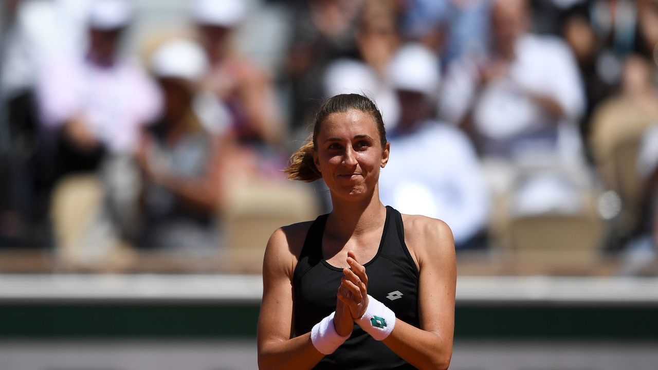 Croatia's Petra Martic applauds and celebrates after winning against Estonia's Kaia Kanepi during their women's singles fourth round match on day eight of The Roland Garros 2019 French Open tennis tournament in Paris on June 2, 2019.