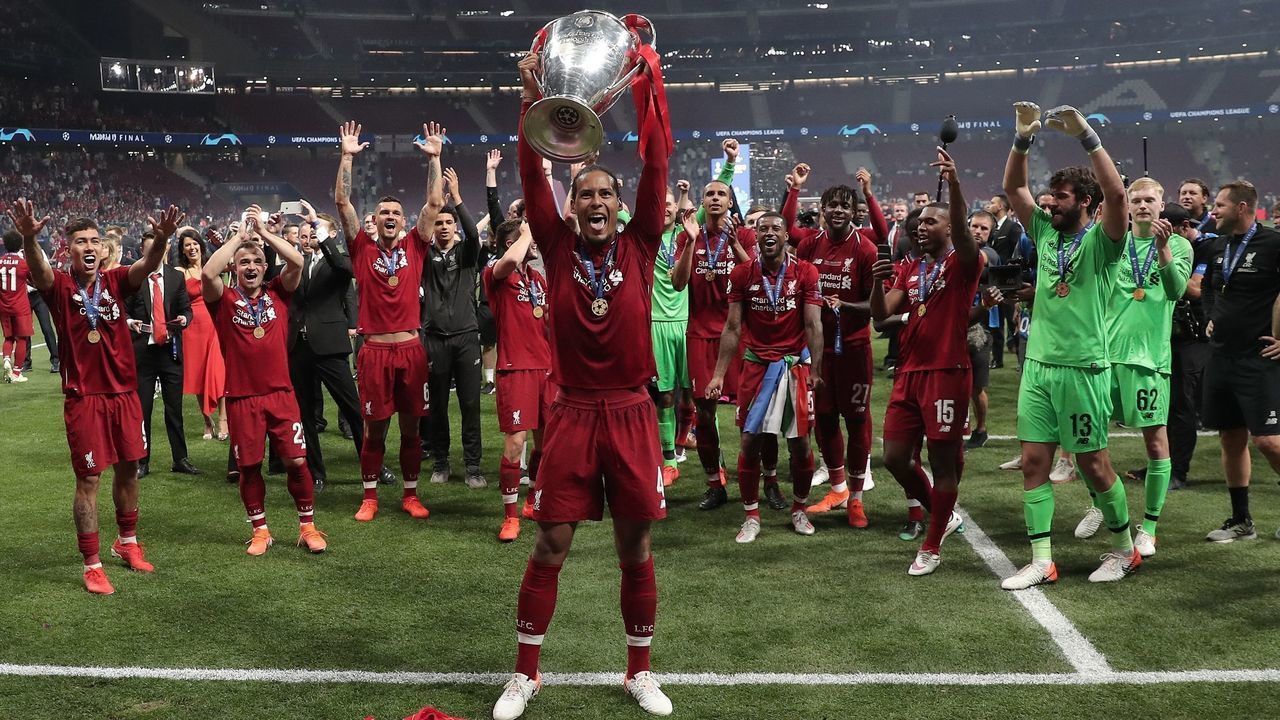 MADRID, SPAIN - JUNE 01: Virgil van Dijk of Liverpool lifts the Champions League Trophy after winning the UEFA Champions League Final between Tottenham Hotspur and Liverpool at the Wanda Metropolitano in Madrid, Spain on June 01, 2019.