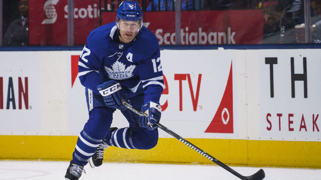 TORONTO, ON - FEBRUARY 25: Patrick Marleau #12 of the Toronto Maple Leafs plays the puck during the first period against the Buffalo Sabres at the Scotiabank Arena on February 25, 2019 in Toronto, Ontario, Canada.