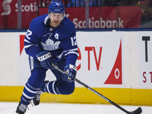 TORONTO, ON - FEBRUARY 25: Patrick Marleau #12 of the Toronto Maple Leafs plays the puck during the first period against the Buffalo Sabres at the Scotiabank Arena on February 25, 2019 in Toronto, Ontario, Canada.