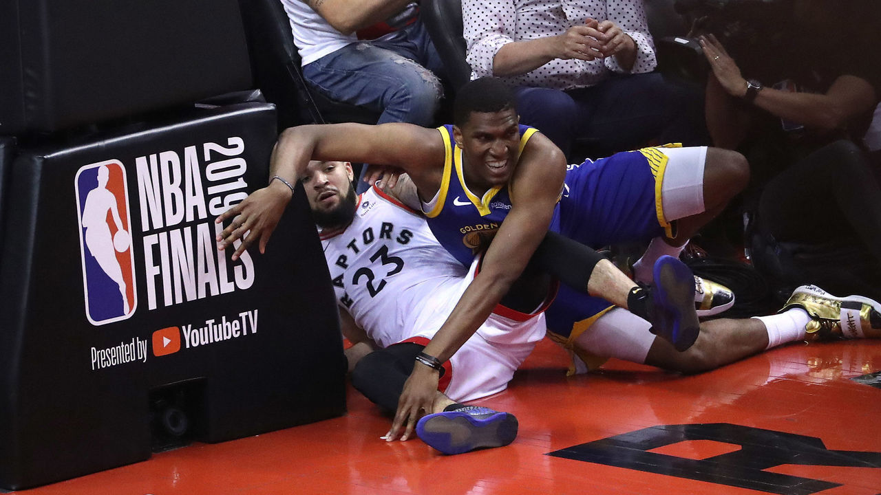 TORONTO, ON- JUNE 2 - Toronto Raptors guard Fred VanVleet (23) is fouled by Golden State Warriors center Kevon Looney (5) as the Toronto Raptors play the Golden State Warriors in game Two of the NBA Finals at Scotiabank Arena in Toronto. June 2, 2019. (Steve Russell/Toronto Star via Getty Images)