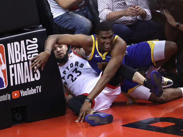 TORONTO, ON- JUNE 2 - Toronto Raptors guard Fred VanVleet (23) is fouled by Golden State Warriors center Kevon Looney (5) as the Toronto Raptors play the Golden State Warriors in game Two of the NBA Finals at Scotiabank Arena in Toronto. June 2, 2019. (Steve Russell/Toronto Star via Getty Images)