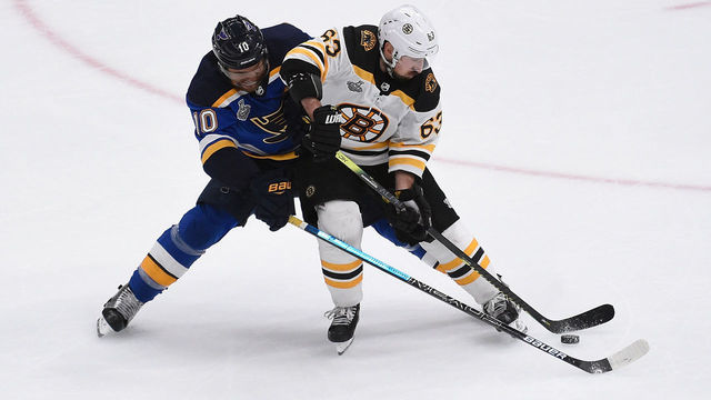 ST. LOUIS, MO - JUNE 1: Brayden Schenn #10 of the St. Louis Blues and Brad Marchand #63 of the Boston Bruins battle for the puck in Game Three of the 2019 NHL Stanley Cup Final at Enterprise Center on June 1, 2019 in St. Louis, Missouri.