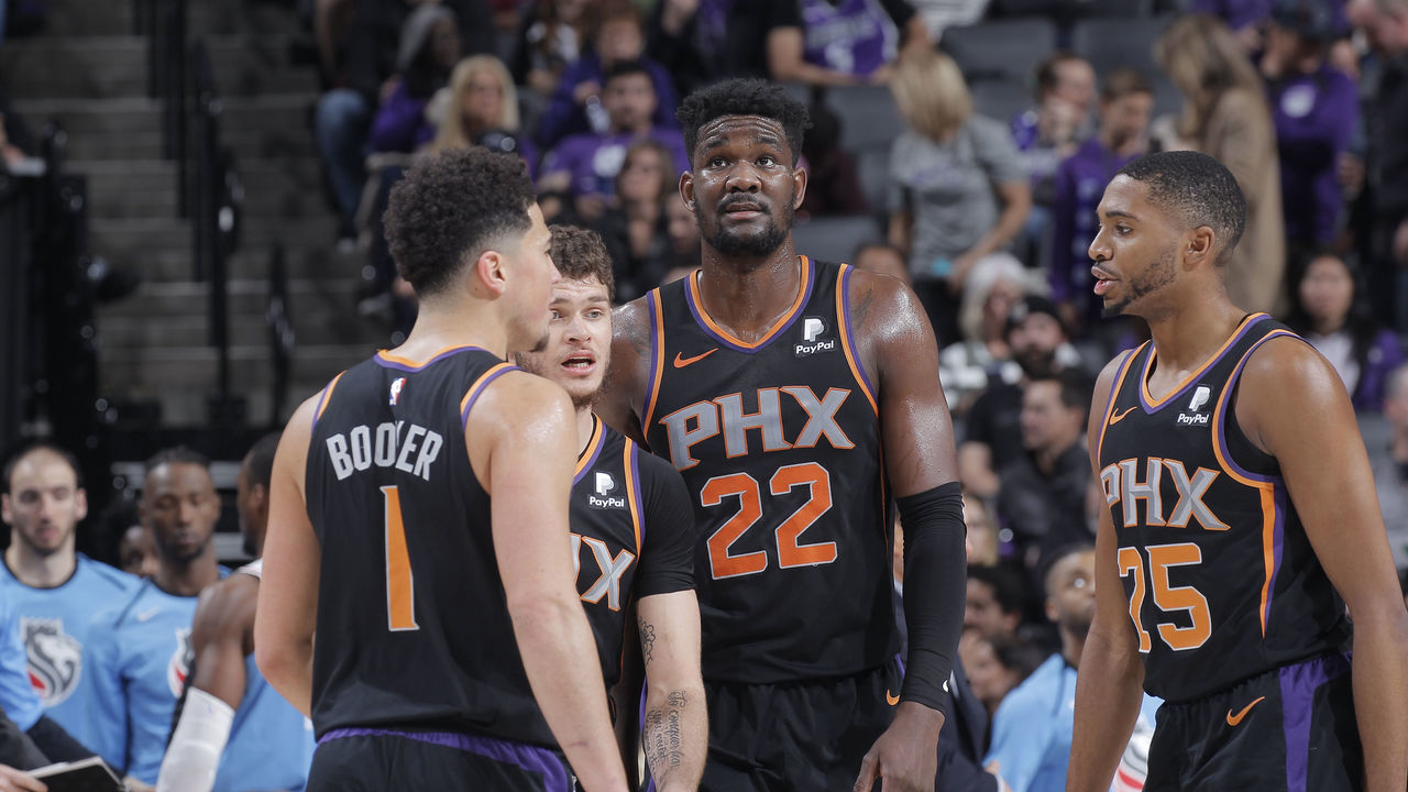 SACRAMENTO, CA - FEBRUARY 10: Devin Booker #1, Tyler Johnson #16, Deandre Ayton #22 and Mikal Bridges #25 of the Phoenix Suns talk during the game against the Sacramento Kings on February 10, 2019 at Golden 1 Center in Sacramento, California. NOTE TO USER: User expressly acknowledges and agrees that, by downloading and or using this photograph, User is consenting to the terms and conditions of the Getty Images Agreement. Mandatory Copyright Notice: Copyright 2019 NBAE