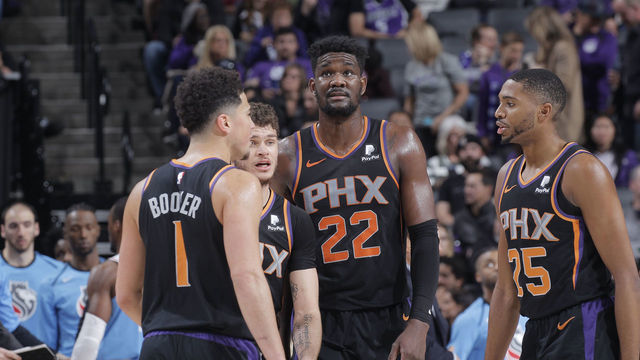 SACRAMENTO, CA - FEBRUARY 10: Devin Booker #1, Tyler Johnson #16, Deandre Ayton #22 and Mikal Bridges #25 of the Phoenix Suns talk during the game against the Sacramento Kings on February 10, 2019 at Golden 1 Center in Sacramento, California. NOTE TO USER: User expressly acknowledges and agrees that, by downloading and or using this photograph, User is consenting to the terms and conditions of the Getty Images Agreement. Mandatory Copyright Notice: Copyright 2019 NBAE