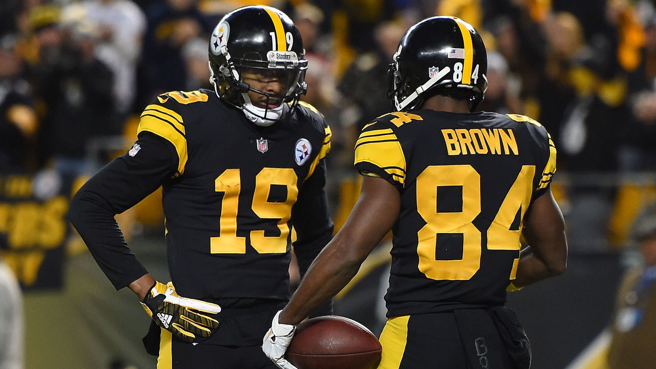 PITTSBURGH, PA - DECEMBER 16: Antonio Brown #84 of the Pittsburgh Steelers celebrates with JuJu Smith-Schuster #19 after a 17 yard touchdown reception in the first quarter during the game against the New England Patriots at Heinz Field on December 16, 2018 in Pittsburgh, Pennsylvania.