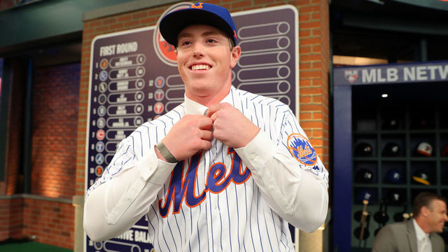 SECAUCUS, NJ - JUNE 03: Brett Baty puts on a New York Mets jersey after being selected 12th overall by the New York Mets during the 2019 Major League Baseball Draft at Studio 42 at the MLB Network on Monday, June 3, 2019 in Secaucus, New Jersey.