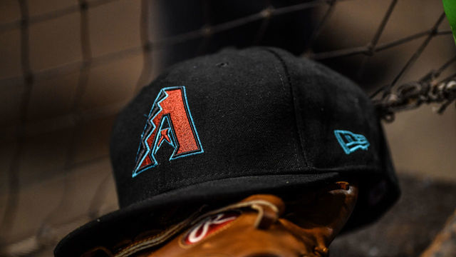 MIAMI, FL - JUNE 26: A detailed view of the New Era ball cap of the Arizona Diamondbacks in the dugout during the game against the Miami Marlins at Marlins Park on June 26, 2018 in Miami, Florida.