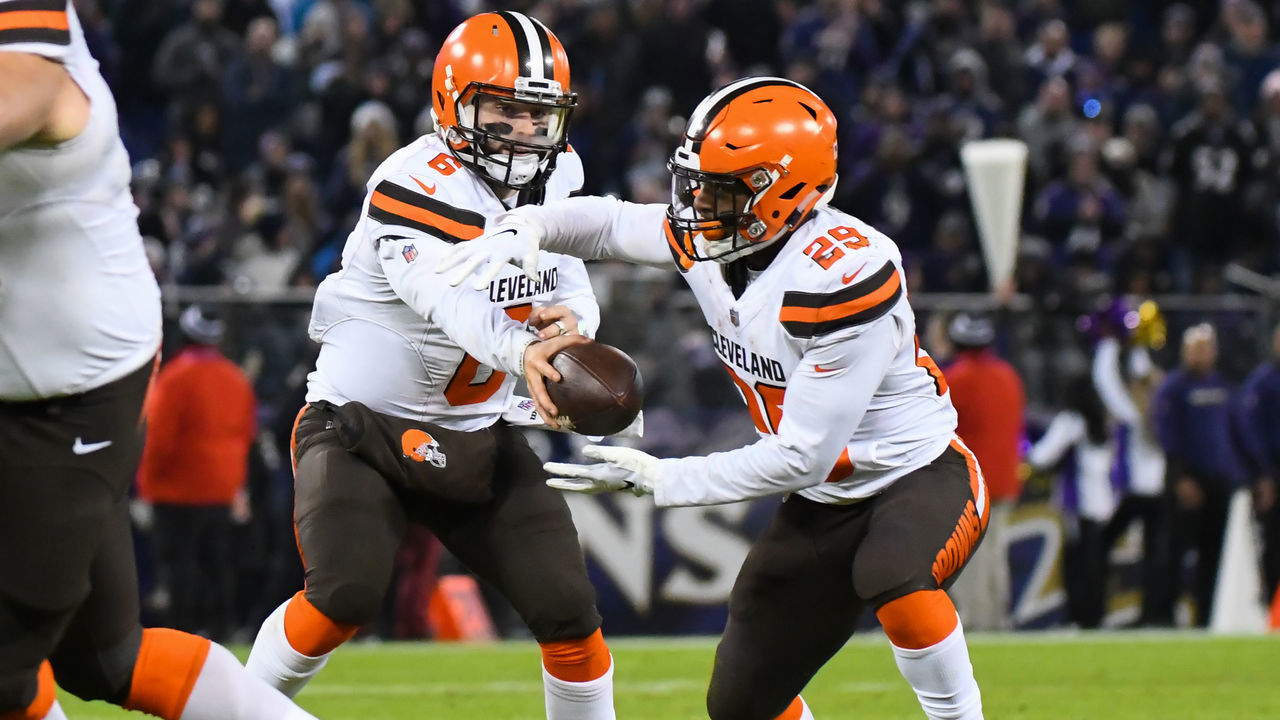 BALTIMORE, MD - DECEMBER 30, 2018: Quarterback Baker Mayfield #6 of the Cleveland Browns hands the ball to running back Duke Johnson #29 in the fourth quarter of a game against the Baltimore Ravens on December 30, 2018 at M&T Bank Stadium in Baltimore, Maryland. Baltimore won 26-24. (Photo by: 2018 Nick Cammett/Diamond Images/Getty Images)