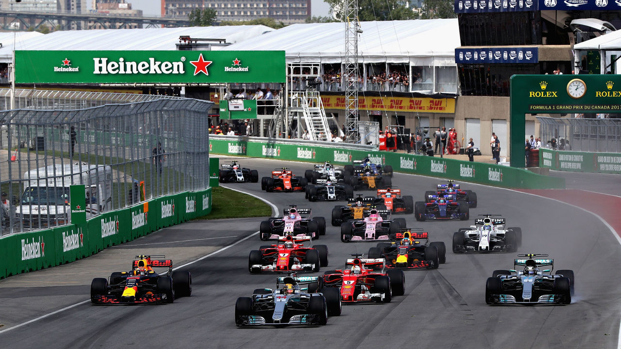MONTREAL, QC - JUNE 11: Lewis Hamilton of Great Britain driving the (44) Mercedes AMG Petronas F1 Team Mercedes F1 WO8 leads Valtteri Bottas driving the (77) Mercedes AMG Petronas F1 Team Mercedes F1 WO8 Sebastian Vettel of Germany driving the (5) Scuderia Ferrari SF70H Max Verstappen of the Netherlands driving the (33) Red Bull Racing Red Bull-TAG Heuer RB13 TAG Heuer and the rest of the field towards the first corner during the Canadian Formula One Grand Prix at Circuit Gilles Villeneuve on June 11, 2017 in Montreal, Canada.