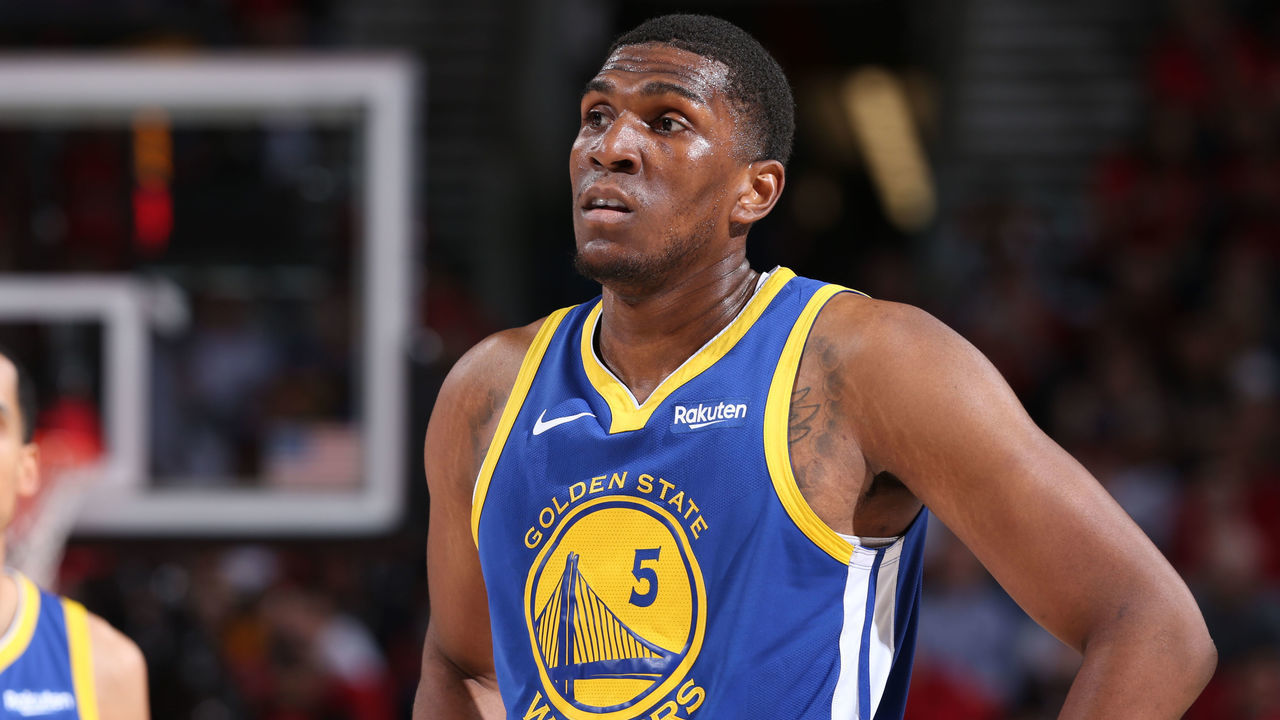 PORTLAND, OR - MAY 20: Kevon Looney #5 of the Golden State Warriors looks on during Game Four of the Western Conference Finals against the Portland Trail Blazers on May 20, 2019 at the Moda Center in Portland, Oregon. NOTE TO USER: User expressly acknowledges and agrees that, by downloading and/or using this photograph, user is consenting to the terms and conditions of the Getty Images License Agreement. Mandatory Copyright Notice: Copyright 2019 NBAE