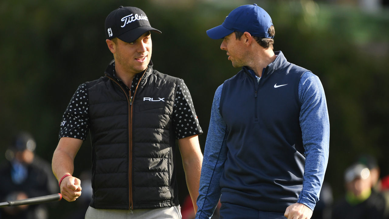PACIFIC PALISADES, CALIFORNIA - FEBRUARY 15: Justin Thomas (L) and Rory McIlroy of Northern Ireland walk off the 2nd hole green during the continuation of the first round of the Genesis Open at Riviera Country Club on February 15, 2019 in Pacific Palisades, California.