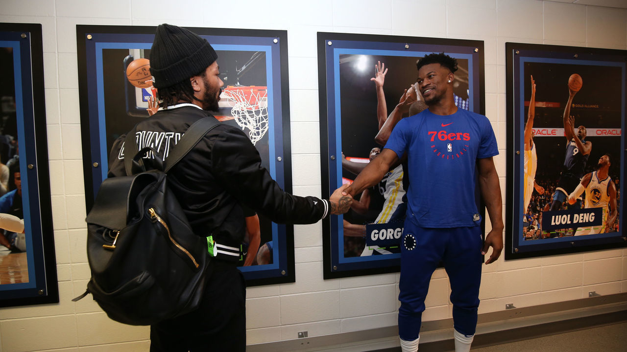 MINNEAPOLIS, MN - MARCH 30: Jimmy Butler #23 of the Philadelphia 76ers chats with Derrick Rose #25 of the Minnesota Timberwolves before the game on March 30, 2019 at Target Center in Minneapolis, Minnesota. Mandatory Copyright Notice: Copyright 2019 NBAE