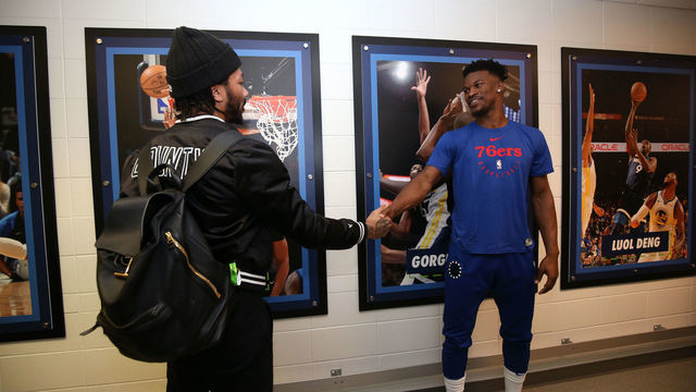 MINNEAPOLIS, MN - MARCH 30: Jimmy Butler #23 of the Philadelphia 76ers chats with Derrick Rose #25 of the Minnesota Timberwolves before the game on March 30, 2019 at Target Center in Minneapolis, Minnesota. Mandatory Copyright Notice: Copyright 2019 NBAE