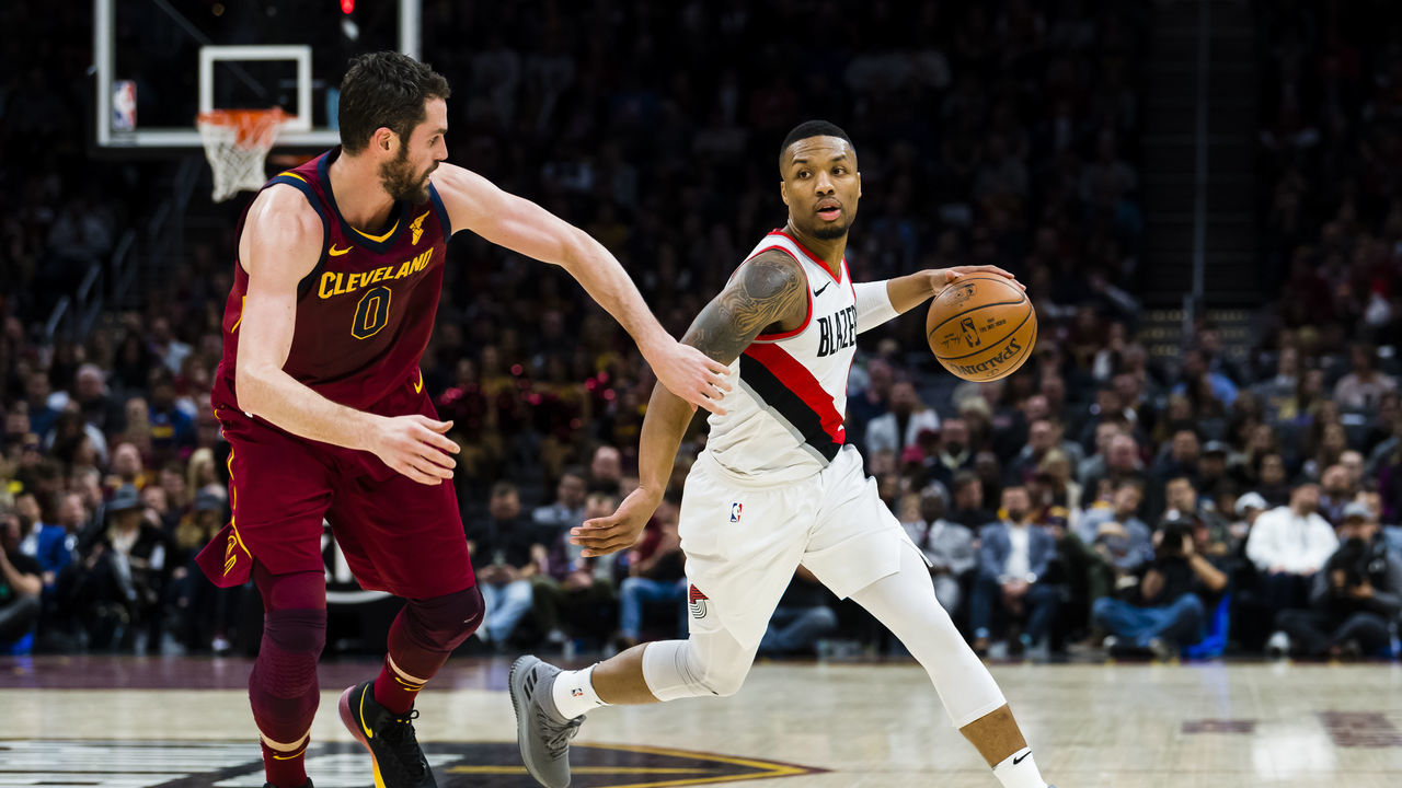 CLEVELAND, OH - JANUARY 2: Kevin Love #0 of the Cleveland Cavaliers guards Damian Lillard #0 of the Portland Trail Blazers during the second half at Quicken Loans Arena on January 2, 2018 in Cleveland, Ohio. The Cavaliers defeated the Trail Blazers 127-110.
