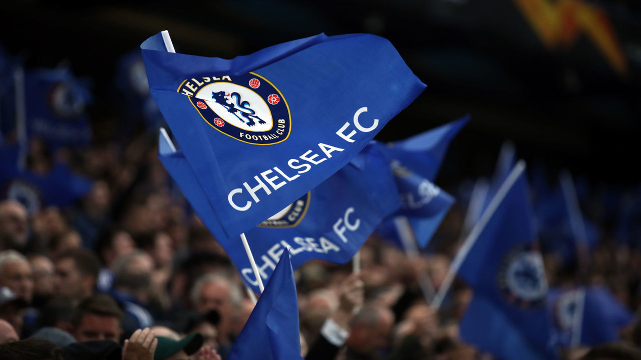 LONDON, ENGLAND - MAY 09: Fans of Chelsea wave their flags during the UEFA Europa League Semi Final Second Leg match between Chelsea and Eintracht Frankfurt at Stamford Bridge on May 09, 2019 in London, England.